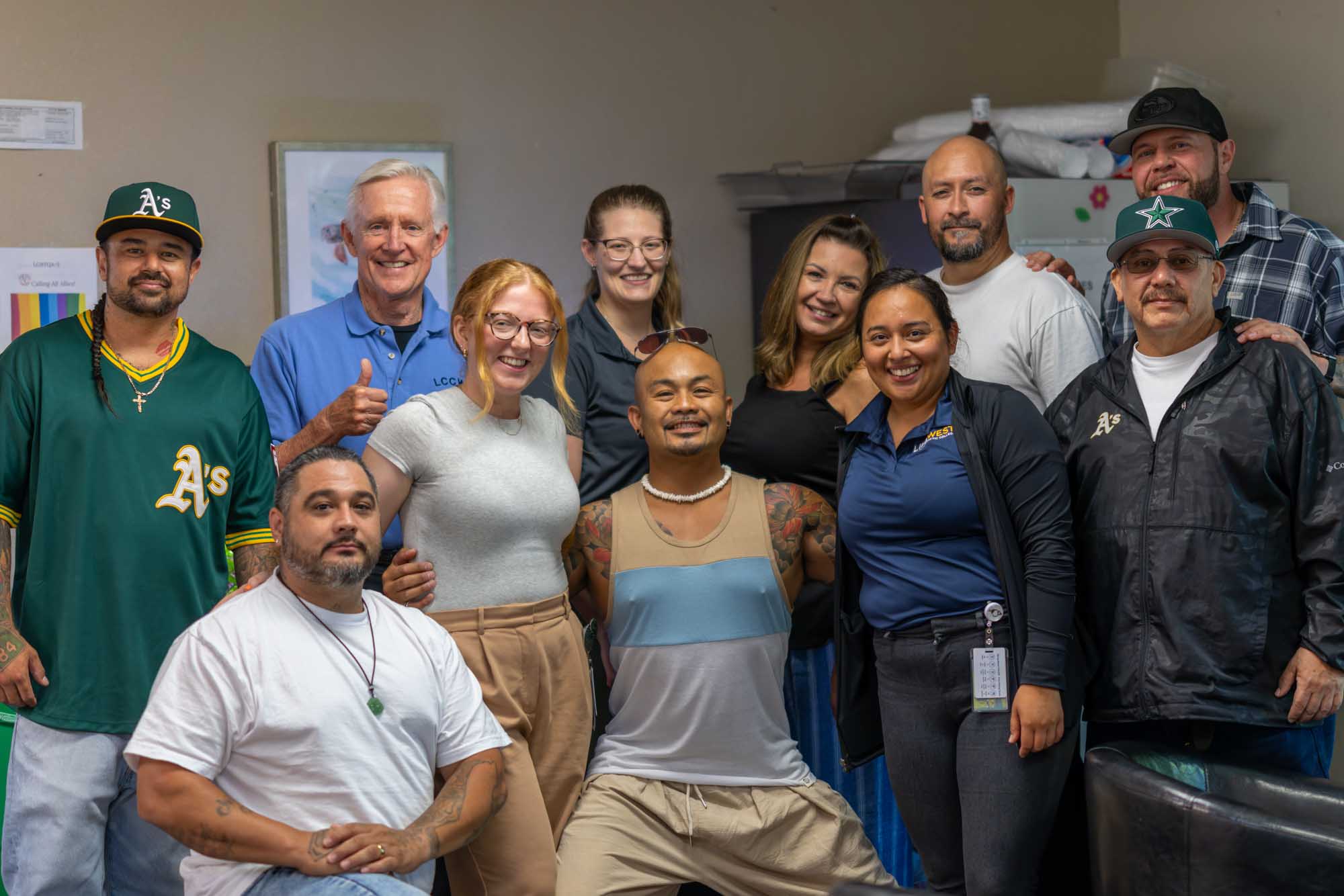 Group photo of Dr. Herby Bell with interns and patients at Second Chance local service