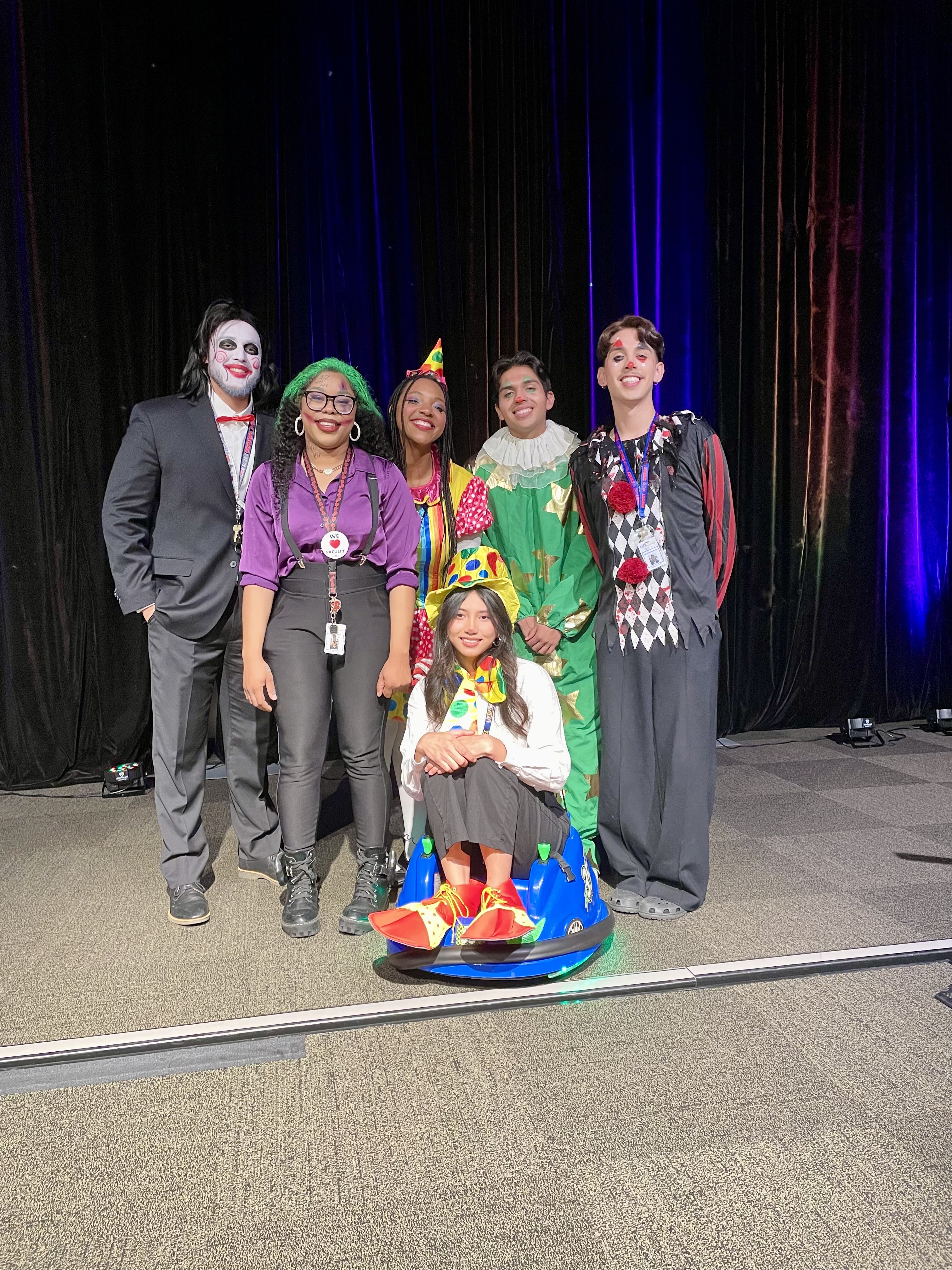 Picture of the Health Center's team of chiropractic assistants dressed up as clowns for Halloween